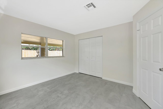 unfurnished bedroom featuring a closet