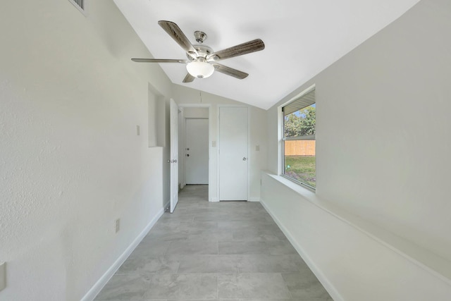 corridor featuring vaulted ceiling