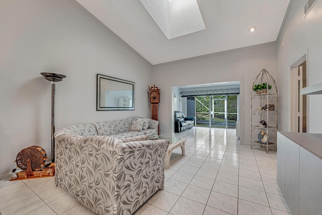 tiled living room with vaulted ceiling with skylight