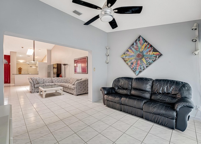 tiled living room with ceiling fan