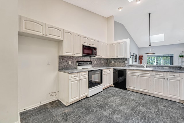 kitchen with pendant lighting, sink, vaulted ceiling with skylight, black appliances, and decorative backsplash