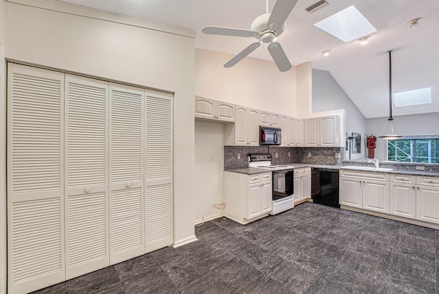 kitchen with lofted ceiling with skylight, sink, tasteful backsplash, black appliances, and white cabinets