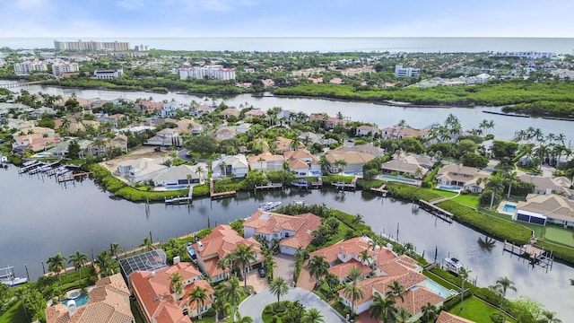 bird's eye view with a water view and a residential view