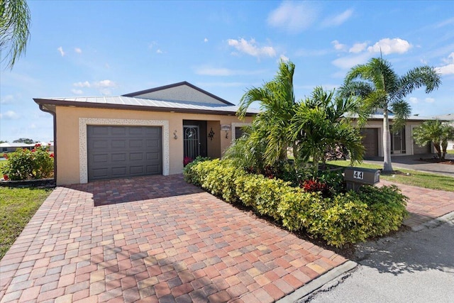 single story home with a garage