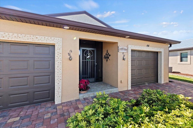 entrance to property featuring a garage