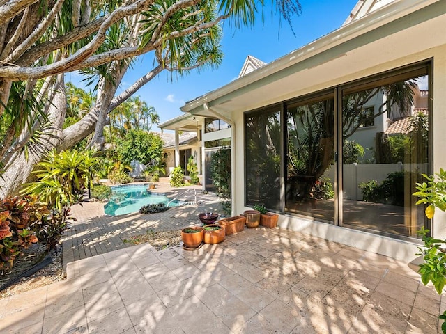 view of patio / terrace with a fenced in pool