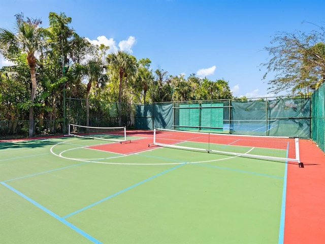 view of sport court with basketball hoop