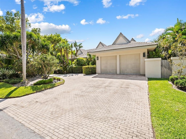 exterior space with a garage and a front yard