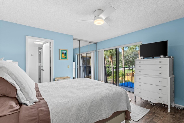 bedroom with ceiling fan, dark hardwood / wood-style flooring, a textured ceiling, and access to outside