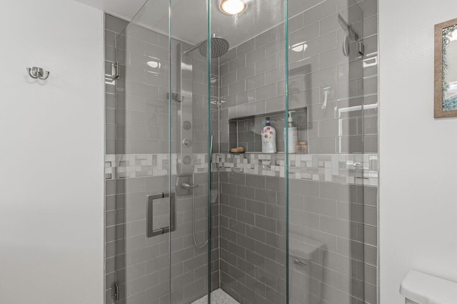 bathroom with a shower with shower door