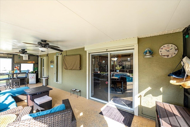 view of patio / terrace featuring ceiling fan