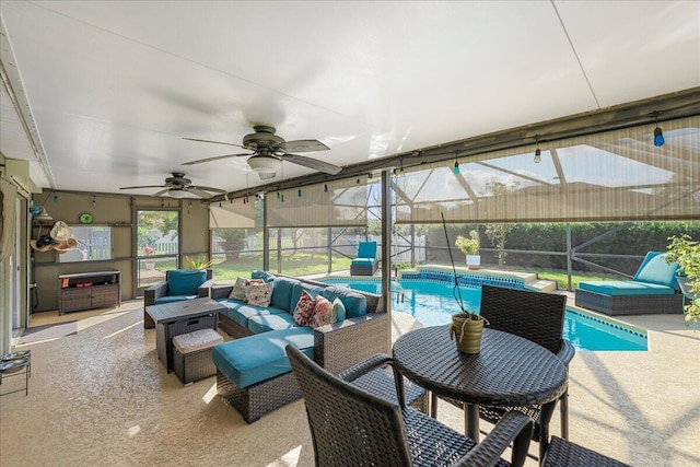 exterior space with ceiling fan, an outdoor hangout area, and glass enclosure