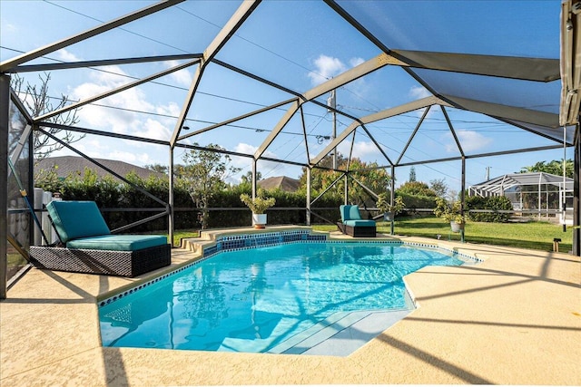 view of swimming pool featuring a mountain view, a patio area, and glass enclosure