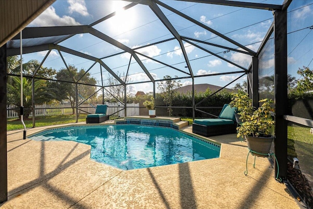 view of swimming pool with a lanai and a patio area