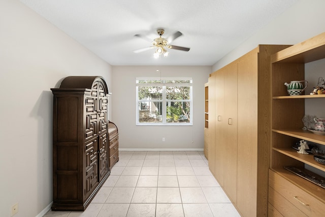 interior space featuring ceiling fan