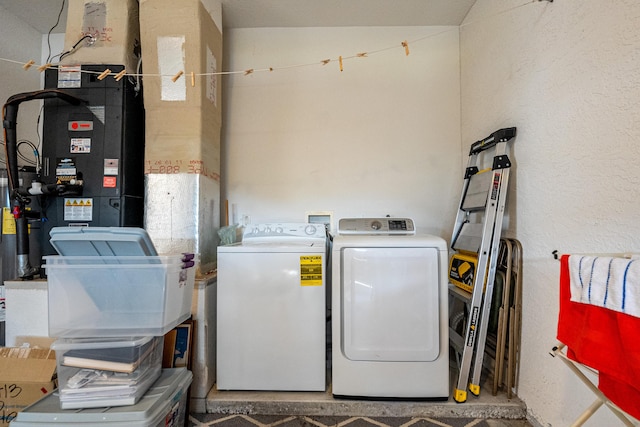 laundry area featuring washing machine and clothes dryer