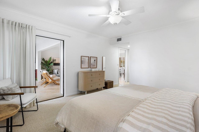 carpeted bedroom featuring crown molding and ceiling fan