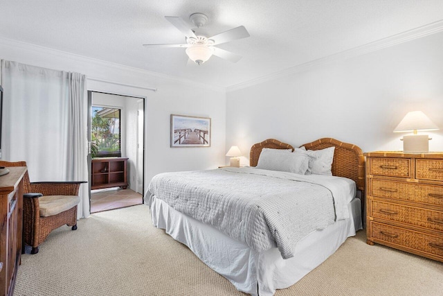 carpeted bedroom featuring ceiling fan, ornamental molding, and access to exterior