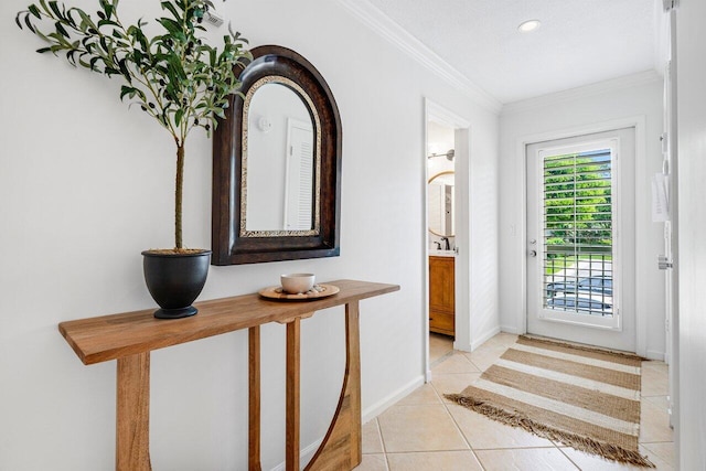 foyer with light tile patterned flooring and ornamental molding