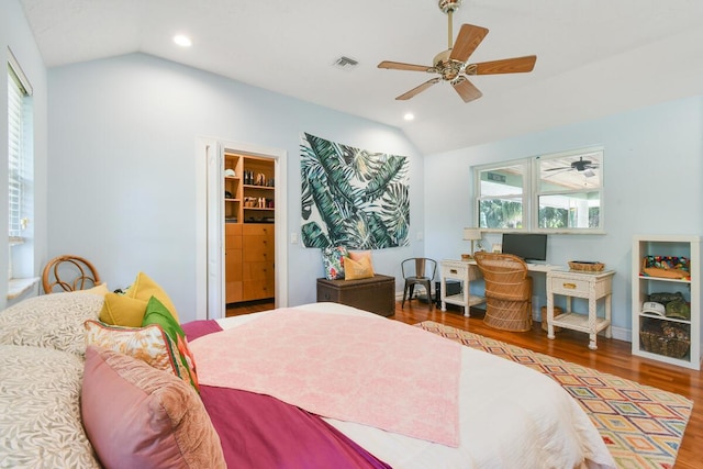 bedroom featuring lofted ceiling, visible vents, wood finished floors, and recessed lighting