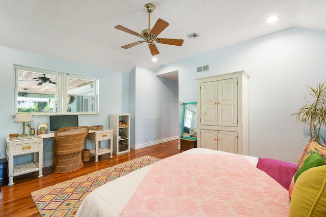 bedroom with lofted ceiling, wood finished floors, visible vents, and recessed lighting