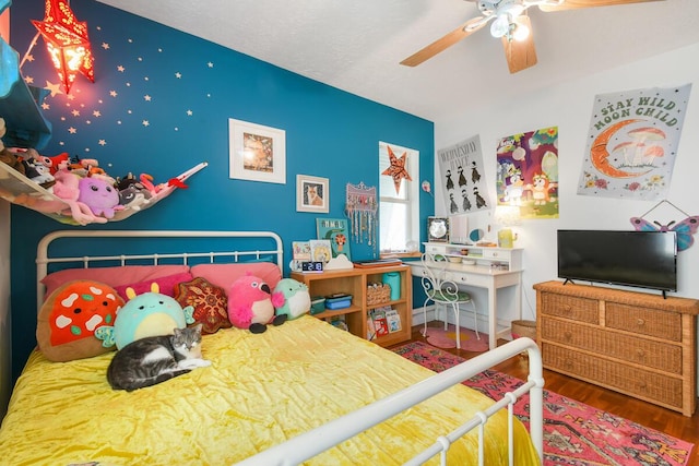 bedroom featuring ceiling fan and wood finished floors