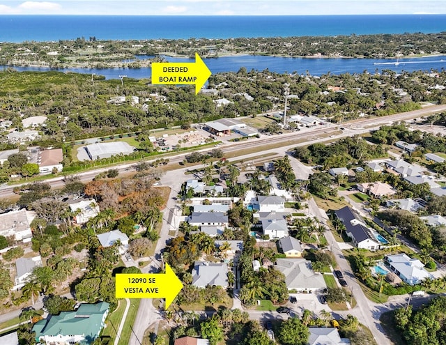 bird's eye view with a residential view and a water view