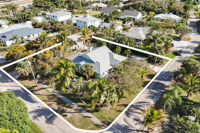 birds eye view of property with a residential view