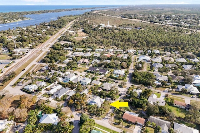 bird's eye view with a residential view and a water view