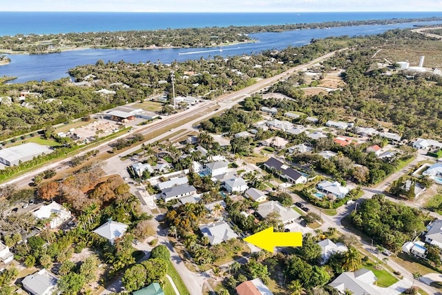 birds eye view of property featuring a water view and a residential view