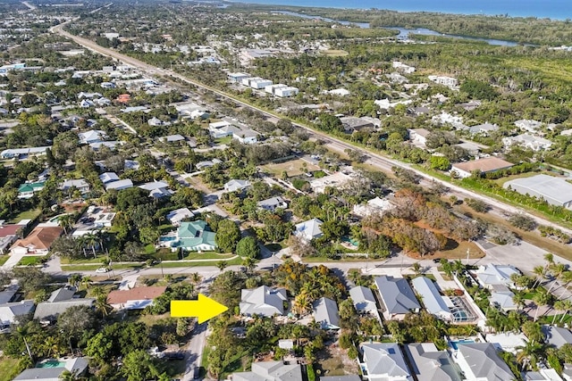 drone / aerial view with a water view and a residential view