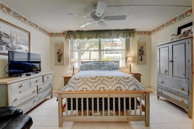 bedroom featuring light tile patterned floors, a textured ceiling, and ceiling fan