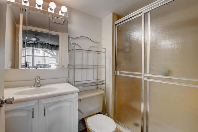 bathroom with vanity, toilet, and walk in shower