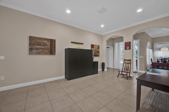 living room with light tile patterned floors and crown molding