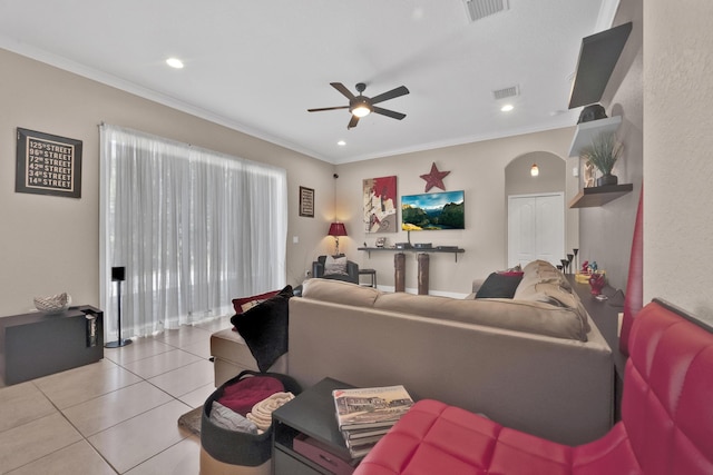 tiled living room with crown molding and ceiling fan