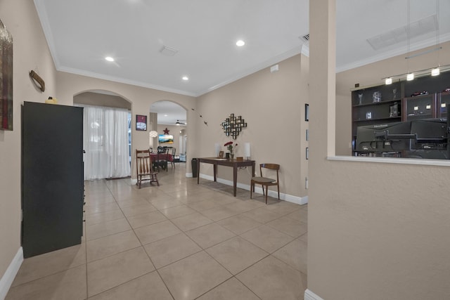 corridor featuring light tile patterned flooring and ornamental molding