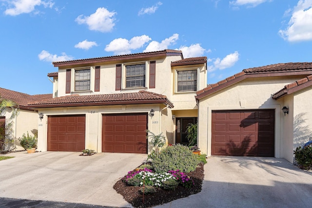 mediterranean / spanish-style house featuring a garage