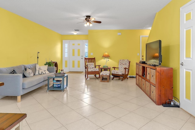 living room featuring ceiling fan and light tile patterned floors