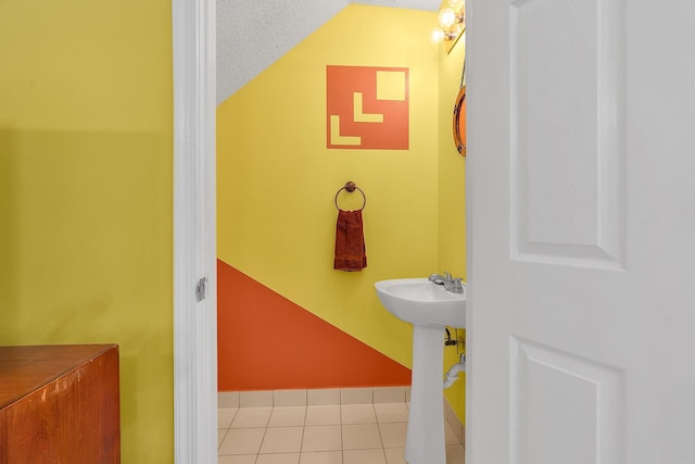 bathroom featuring tile patterned flooring and sink