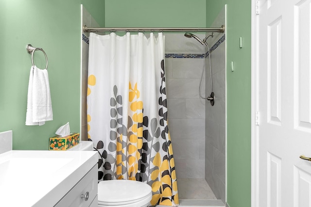 bathroom with vanity, toilet, and curtained shower