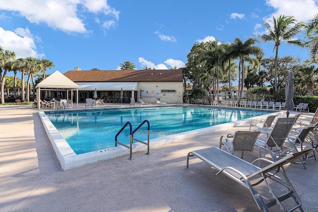 view of swimming pool featuring a patio area