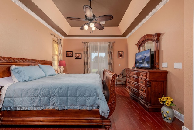 bedroom featuring a raised ceiling, a ceiling fan, dark wood-style floors, access to exterior, and crown molding