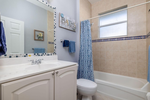 bathroom with shower / tub combo, vanity, and toilet