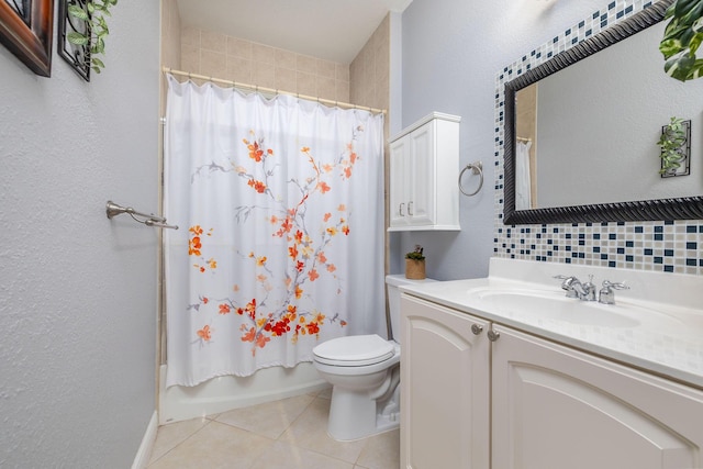 bathroom with toilet, shower / tub combo, vanity, and tile patterned floors