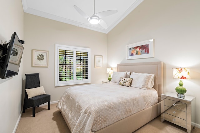 carpeted bedroom featuring crown molding and ceiling fan