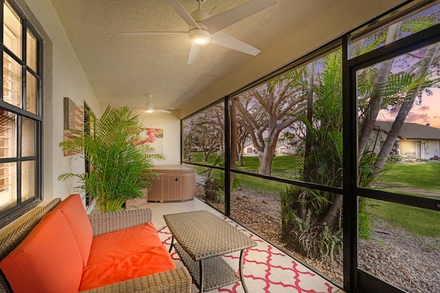 sunroom / solarium with ceiling fan