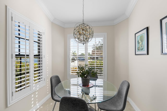 dining room with an inviting chandelier and crown molding