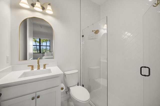 full bathroom featuring a stall shower, vanity, and toilet