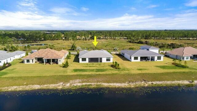 drone / aerial view with a residential view and a water view