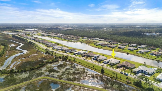 drone / aerial view featuring a water view and a residential view